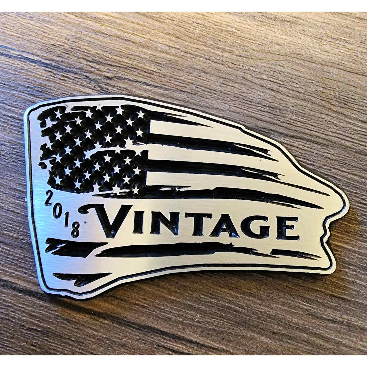 Metallic 'Vintage 2018' American flag design on a wooden surface